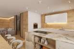 Experience modern living in this stunning property, featuring a beautifully designed kitchen with sleek white cabinetry and a unique marble island.