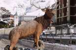 Discover the charm of this property, featuring a stunning wooden elk sculpture as a focal point.