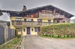Charming chalet-style home nestled in a picturesque setting.