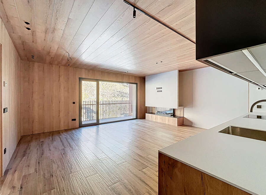 This stunning modern property boasts a seamless blend of natural wood elements and contemporary design.