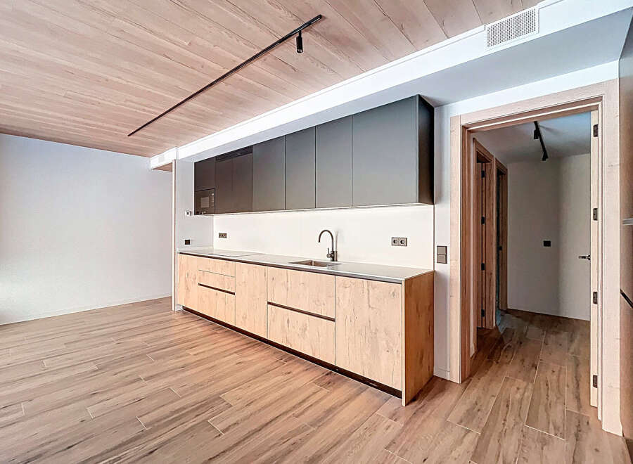 This modern kitchen boasts sleek design and functionality.