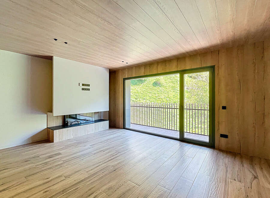 This stunning property boasts a spacious open-plan living area with large windows offering breathtaking views of the surrounding landscape.