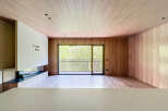 Stunning modern living space with floor-to-ceiling windows offering breathtaking views.