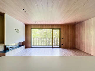 Stunning modern living space with floor-to-ceiling windows offering breathtaking views.