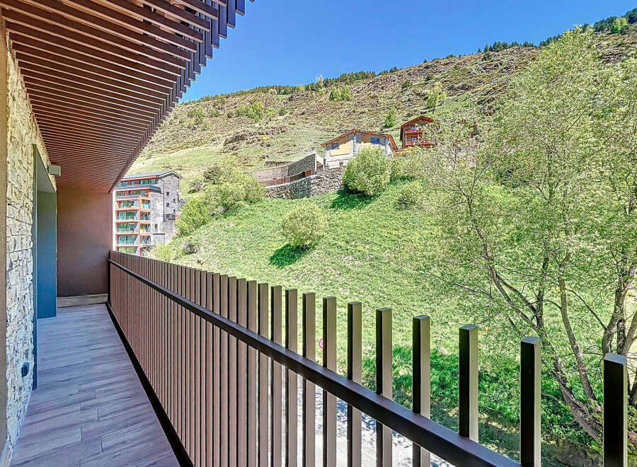 This stunning property boasts a private balcony with breathtaking mountain views.
