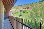 This stunning property boasts a private balcony with breathtaking mountain views.