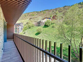 This stunning property boasts a private balcony with breathtaking mountain views.