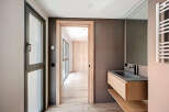 Modern bathroom with floating vanity and sleek fixtures.