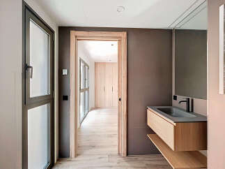 Modern bathroom with floating vanity and sleek fixtures.