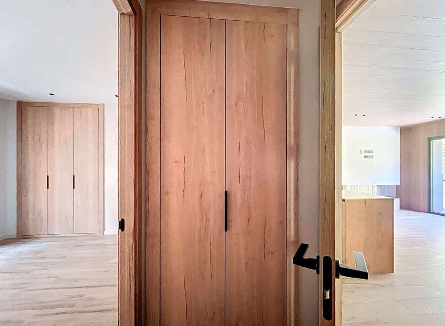 This stunning property boasts sleek, modern design with light oak wood finishes throughout.