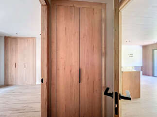 This stunning property boasts sleek, modern design with light oak wood finishes throughout.
