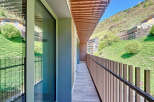 This stunning property boasts a modern balcony with breathtaking mountain views.