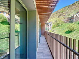 This stunning property boasts a modern balcony with breathtaking mountain views.