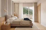 Luxurious mountain view bedroom with a king-size bed and ensuite bathroom.
