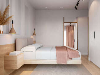 This stunning bedroom boasts a minimalist design with a light and airy feel.