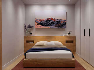 Cozy bedroom with built-in wooden headboard and platform bed, offering ample storage with integrated shelving and a spacious wardrobe.