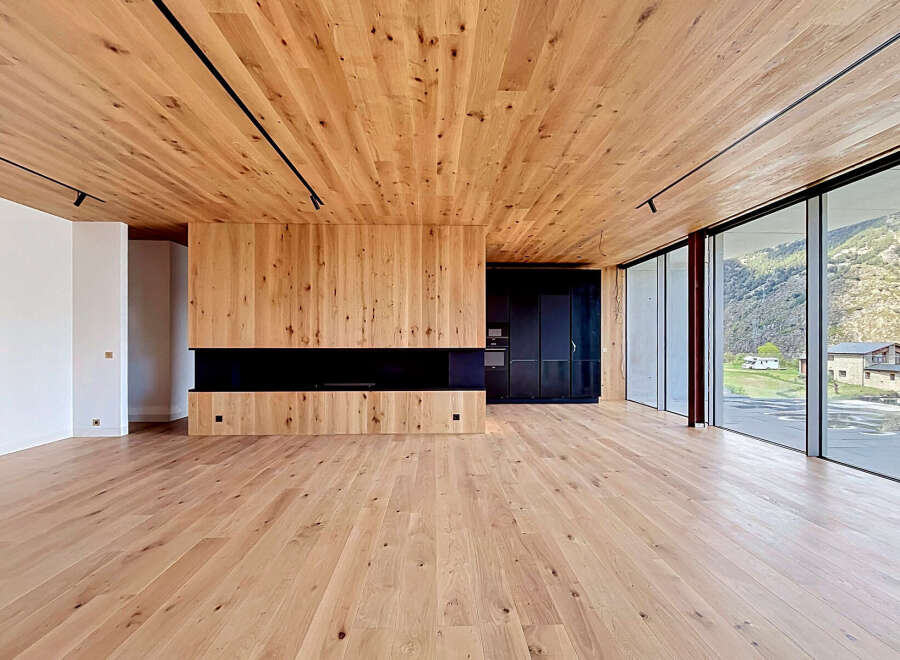 This stunning modern home features a warm and inviting interior with beautiful wood accents throughout.