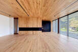 This stunning modern home features a warm and inviting interior with beautiful wood accents throughout.
