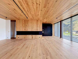This stunning modern home features a warm and inviting interior with beautiful wood accents throughout.