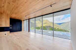 Experience luxury living with this stunning property featuring expansive windows that frame breathtaking mountain views.