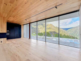 Experience luxury living with this stunning property featuring expansive windows that frame breathtaking mountain views.