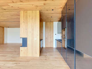 This stunning modern home boasts a seamless blend of natural wood and sleek, contemporary design.