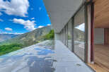 Experience breathtaking mountain views from this modern architectural masterpiece.
