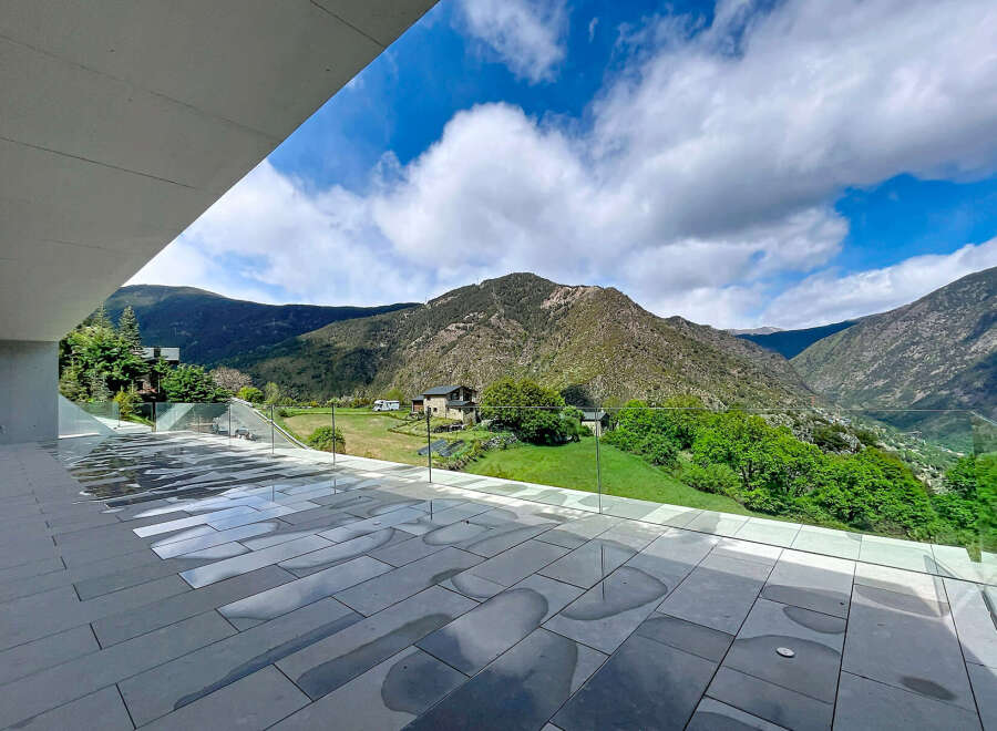 Experience breathtaking mountain views from this modern property.