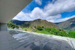 Experience breathtaking mountain views from this modern property.