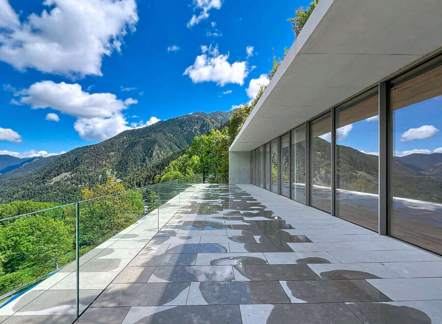 Experience breathtaking mountain views from this modern architectural marvel.
