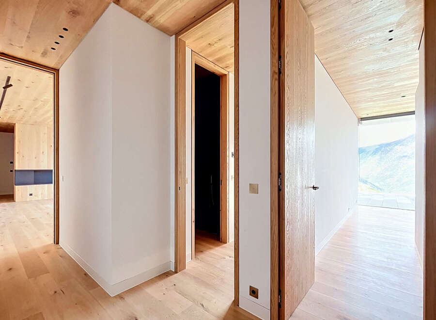 This stunning property boasts a modern interior with a focus on natural materials.
