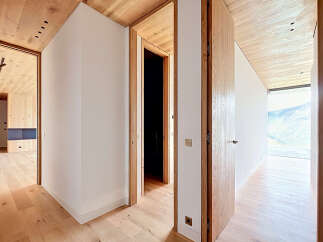 This stunning property boasts a modern interior with a focus on natural materials.