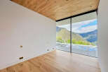 Experience breathtaking views from this modern property featuring expansive windows that frame the stunning mountain landscape.