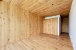This stunning property boasts a warm and inviting interior, featuring exquisite wooden walls, ceilings, and flooring.