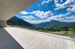 Experience breathtaking panoramic views from this modern property's expansive terrace.