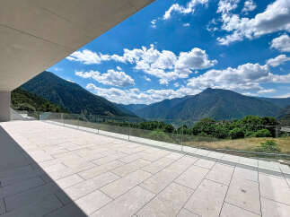 Experience breathtaking panoramic views from this modern property's expansive terrace.