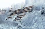 Luxury apartments nestled in a snowy mountainside setting.