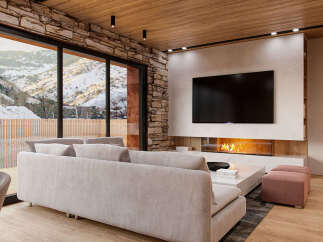 This stunning property boasts a spacious living area with floor-to-ceiling windows offering breathtaking mountain views.