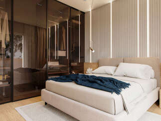 This stunning bedroom boasts a built-in wardrobe with mirrored sliding doors, offering ample storage space.