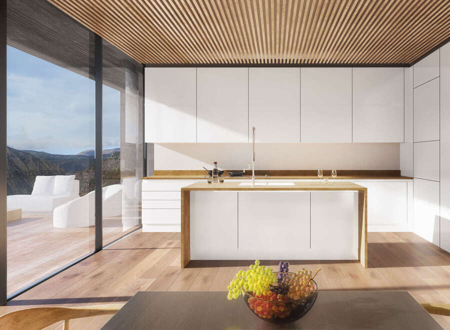 Modern kitchen with stunning mountain views.