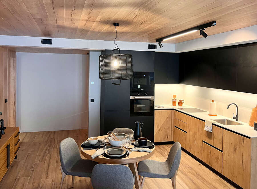 Experience modern living in this stylish kitchen and dining area.