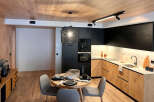 Experience modern living in this stylish kitchen and dining area.