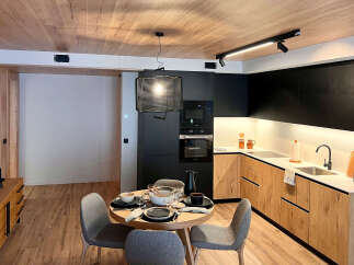 Experience modern living in this stylish kitchen and dining area.