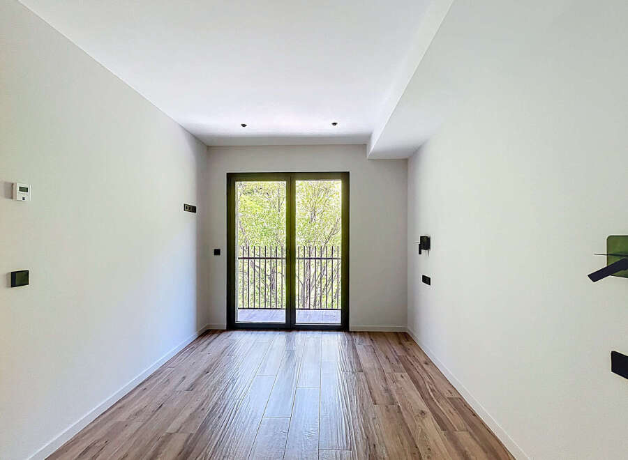 This stunning property boasts a bright and airy interior with large windows offering ample natural light.