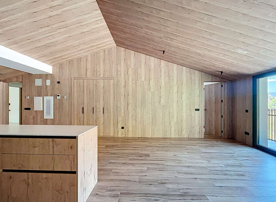 This stunning property boasts a modern, minimalist design with natural wood finishes throughout.