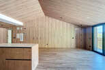 This stunning property boasts a modern, minimalist design with natural wood finishes throughout.