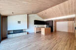 This stunning modern home features a spacious open-concept design with a beautiful kitchen and a cozy fireplace.
