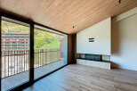 Experience luxury living in this stunning property featuring a modern fireplace and expansive windows.