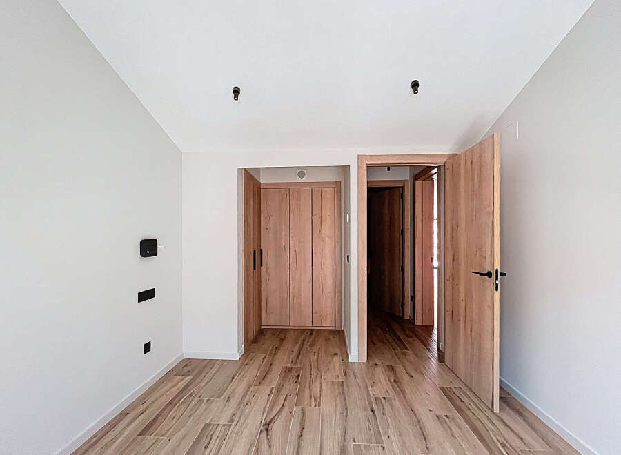 Step into this beautifully designed space, featuring stunning wooden floors and doors that exude warmth and elegance.