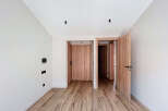 Step into this beautifully designed space, featuring stunning wooden floors and doors that exude warmth and elegance.